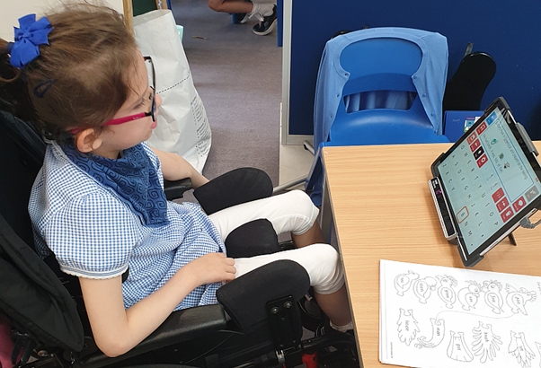 child using a tablet computer controlling with eye gaze camera