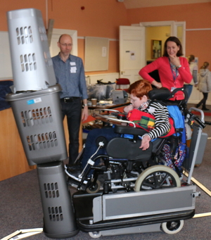 Boy knocking over tower with Smart Wheelchair