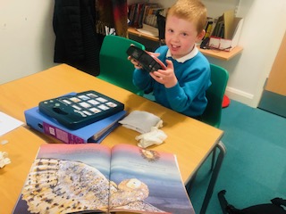 A learner using CALL Scotlandâ€™s Bookbug symbolised resources as part of an initial AAC assessment.