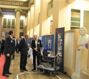 The Duke of Edinburgh discussing the smart wheelchair with Paul Nisbet