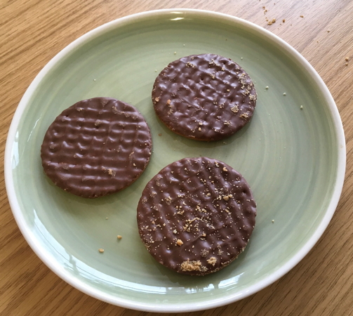 Plate with three biscuits.